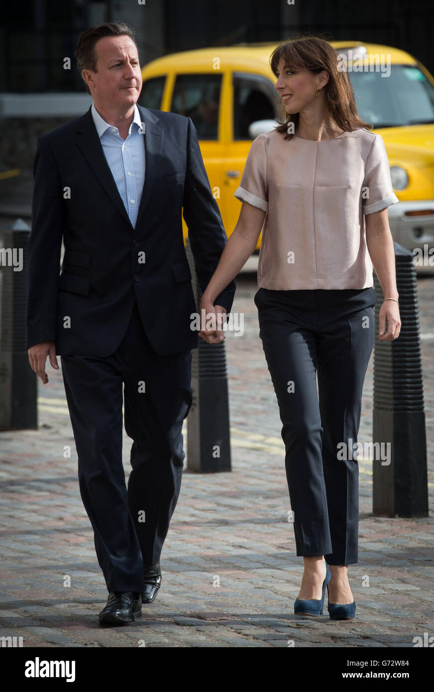 Prime Minister David Cameron and his wife Samantha arrive at Methodist Central Hall in Westminster to vote. Polling has opened across Britain as millions of voters cast their ballots in European and local council elections. Stock Photo