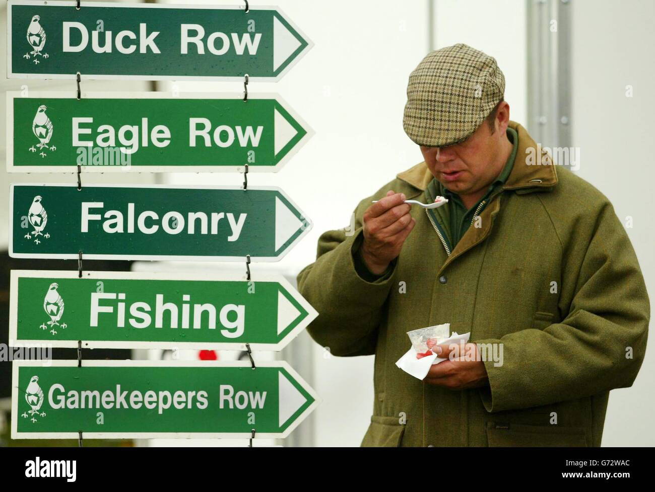 A visitor enjoys the food at The Scottish Game Fair held a Scone Palace