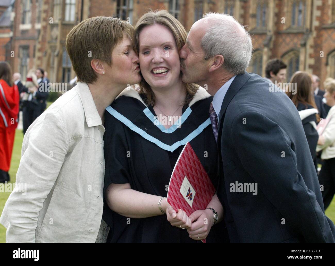 Claire Gallagher, 21 is kissed on the cheek by her parents Marie and Seamus Gallagher at the Queen's University, Belfast, after she received her BA honours degree in music. Clair was blinded in the Omagh bomb atrocity in August 1998. Stock Photo