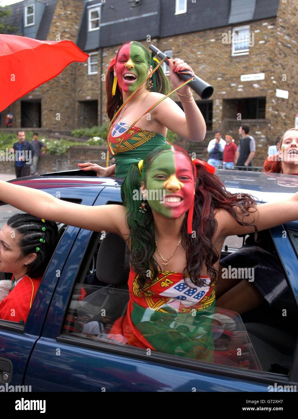 Portugese fans gather in London's South Lambeth Road to support their national Portugese football team who are playing in the Euro 2004 finals tonight against Greece in Lisbon. Stock Photo