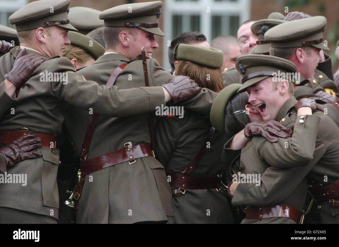 Newly graduated officers celebrating after their commissioning ceremony, at the Military College, Defence Forces Training Centre, Curragh Camp, Co Kildare, Ireland. 46 members of the 79th Cadet Class were commissioned after 21 months intensive training to become Second Lieutenants. Stock Photo