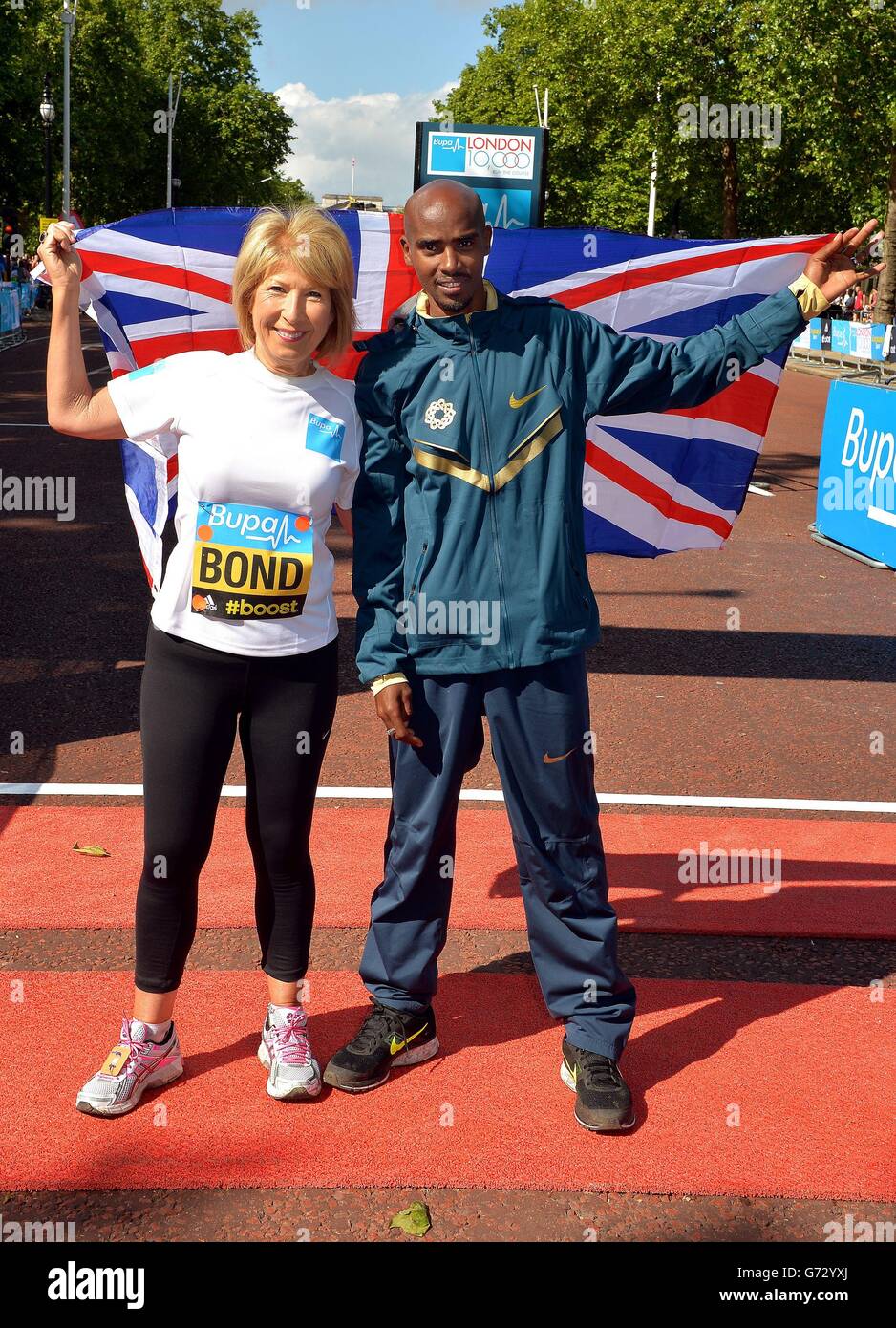 Jennie Bond the former BBC Royal reporter with Mo Farah, the double Olympic Gold Medalist, in the Mall, central London before the start of the BUPA London 10,000 run. Stock Photo
