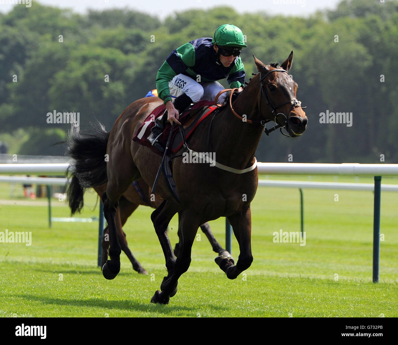 Dubai Hills ridden by Daniel Tudhope wins the haydock-park.co.uk Handicap Stakes during the Sandy Lane Stakes day at Haydock Park Racecourse. Stock Photo