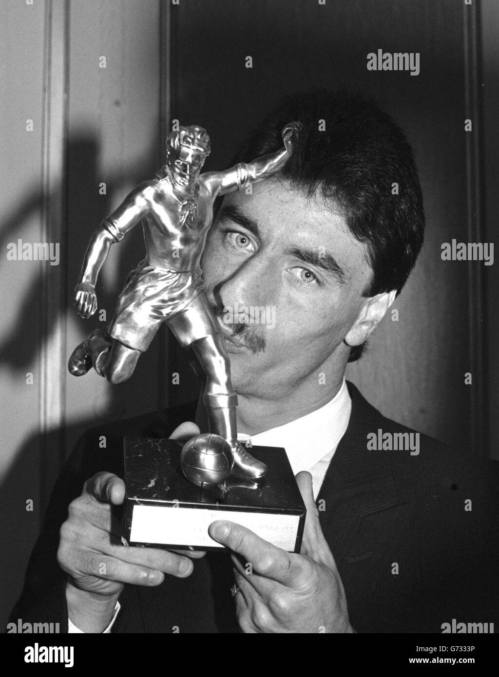 Liverpool striker Ian Rush, kisses the trophy after being presented with the Football Writers Association Player of the Year Award at the Cafe Royal in London. Stock Photo