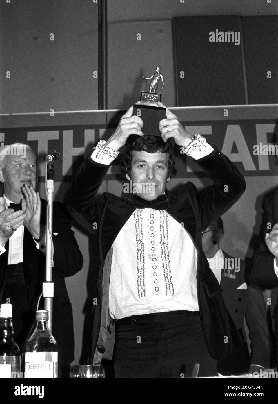 Footballer of the Year 1973-74, Ian Callaghan (Liverpool and England), holds aloft the trophy at the Football Writers Association Awards dinner at the Bloomsbury Centre Hotel. Ian's Liverpool team mates are in London sor the Cup Final match against Newcastle United at Wembley. Stock Photo