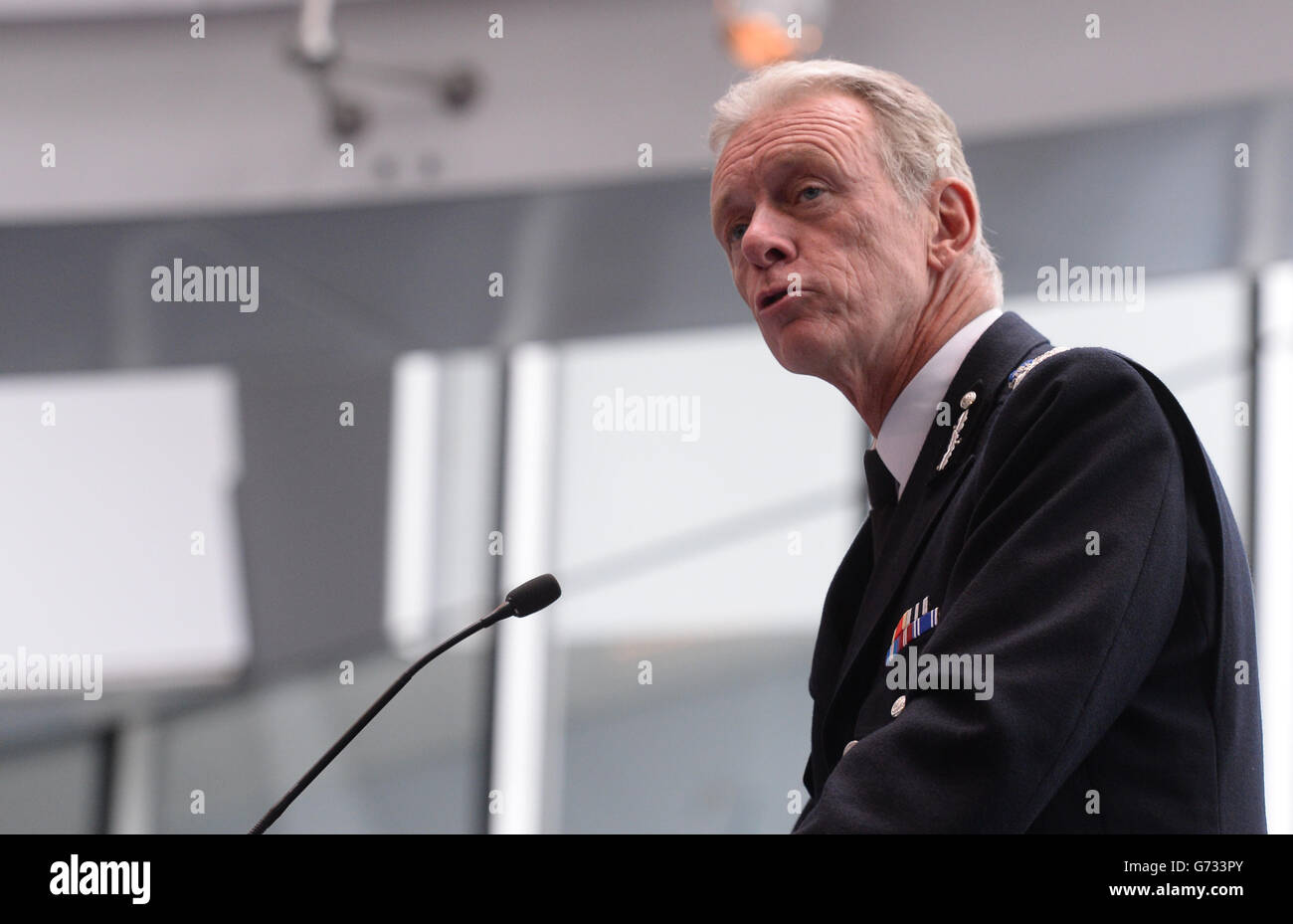 Metropolitan Police Commissioner Bernard Hogan-Howe speaks to the conference Policing Global Cities: Gangs Summit at City Hall in London, which has been set up to bring together city leaders from around the word to discuss how to tackle the problem of gangs. Stock Photo