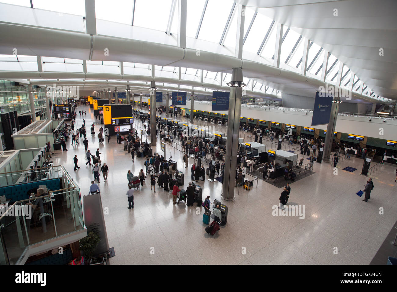 Passengers arrive at the new Terminal 2, the Queen's Terminal at Heathrow on it's first day of operation. Stock Photo