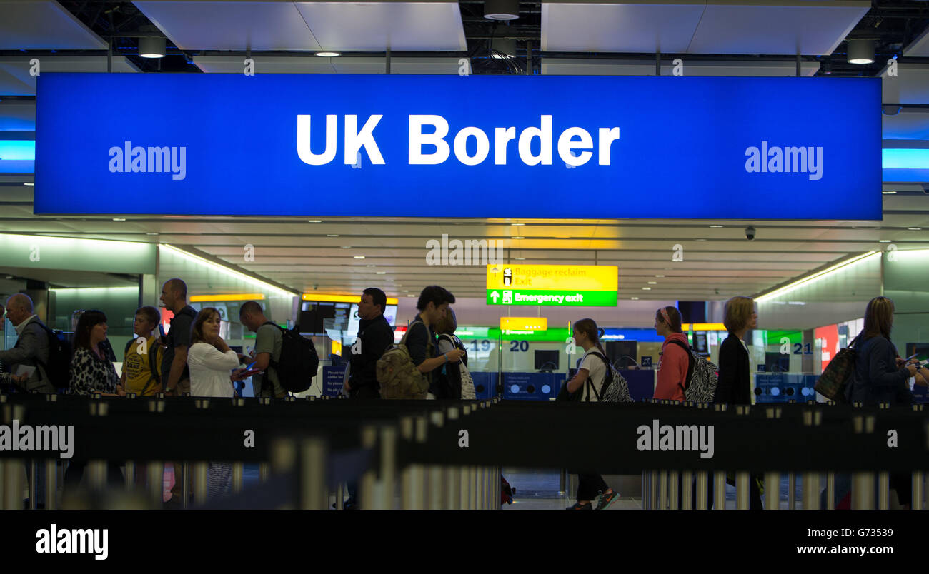 Passengers pass through the border controls in the new Terminal 2, the Queen's Terminal at Heathrow on it's first day of operation. Stock Photo