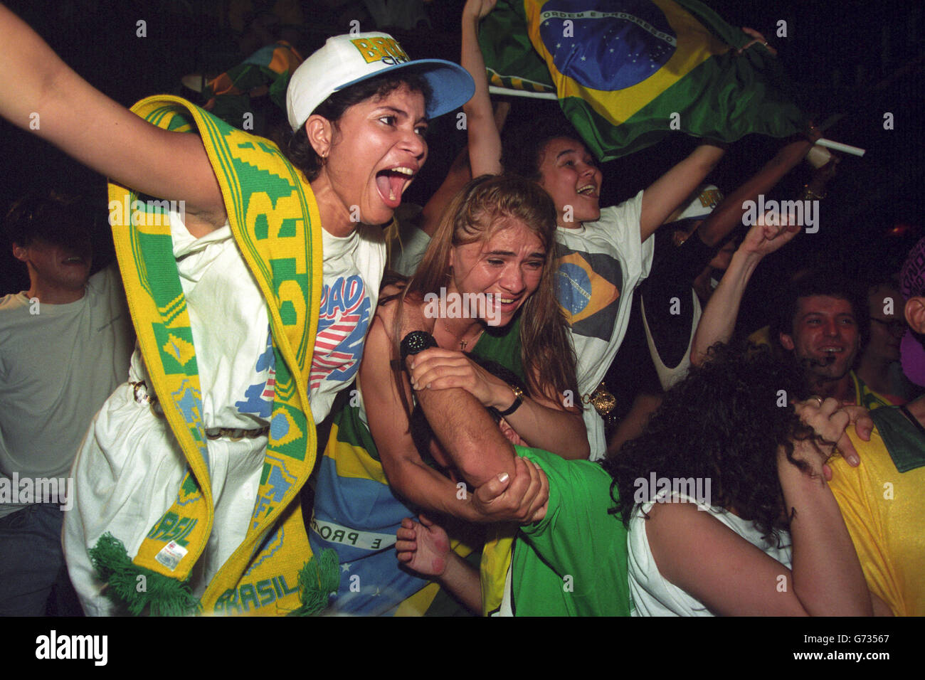 Soccer - World Cup 1994 - Brazil Fans - London. Brazil fans celebrate at the Salsa Club in London's Soho, after watching their team win the World Cup Final against Italy. Stock Photo