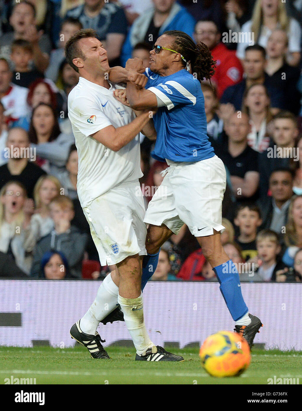 England's Jonathan Wilkes and The Rest of the World's Edgar Davids come