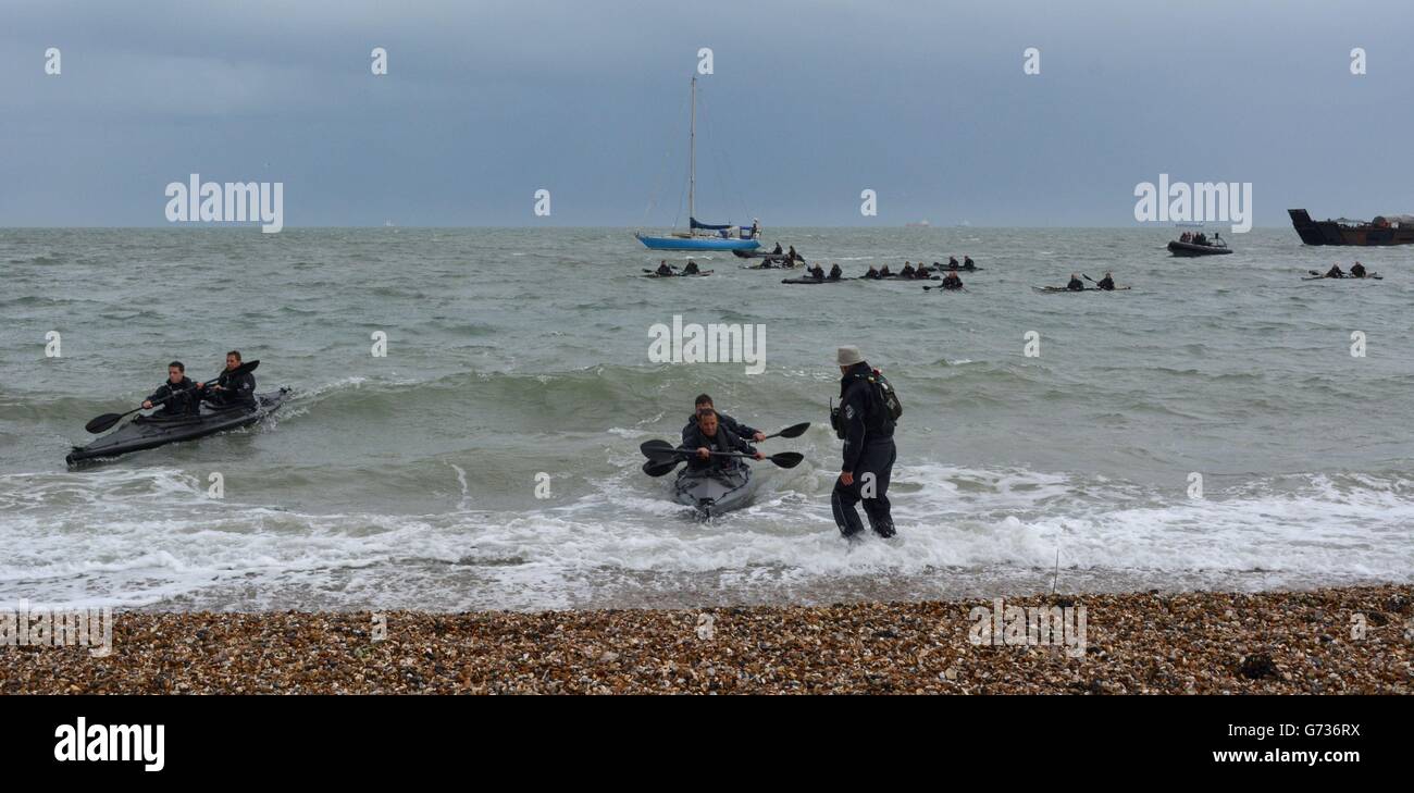 A team of Royal Marines arrive at Southsea, Portsmouth, Hampshire, having kayaked for 30 hours across the English Channel from Port en Bessin, Normandy, France. It is the latest leg of the 1664 Kayak Challenge to mark the 350th anniversary of the Royal Marines. Stock Photo