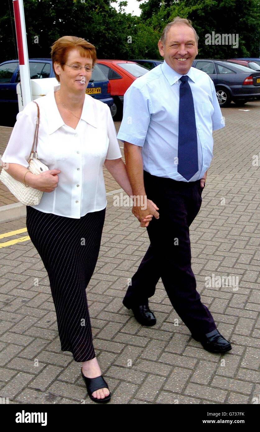 A laundry company was fined 325,000 today for breaching health and safety rules after a worker became trapped inside a washing machine and died from hypothermia. David and Sue Clegg, parents of Paul Clegg who died trapped inside a washing machine pictured outside Bournemouth Crown Court. Stock Photo