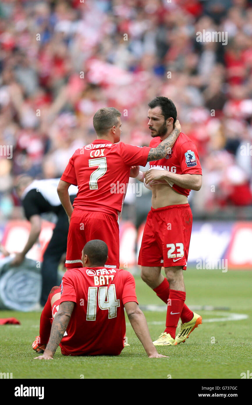 Leyton Orient's Chris Dagnall (right) is consoled by team-mate Dean Cox after the game after his penalty was saved by Rotheham United goalkeeper Adam Collin Stock Photo