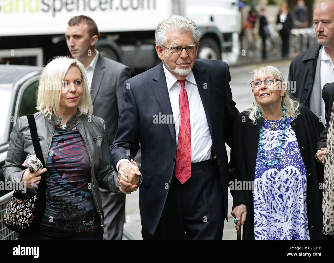 Veteran entertainer Rolf Harris arriving with daughter Bindi (left), wife Alwen at Southwark Crown Court, London, where he he denies 12 counts of indecent assault between 1968 and 1986. Stock Photo