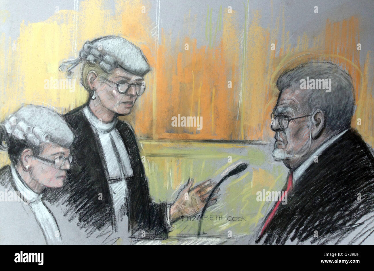 Court artist sketch by Elizabeth Cook of Rolf Harris as he is cross-examined by prosecutor Sasha Wass QC (centre) and watched by junior prosecution council Esther Schutzer-Wessmann at Southwark Crown Court, London where he denies 12 counts of indecent assault between 1968 and 1986. Stock Photo