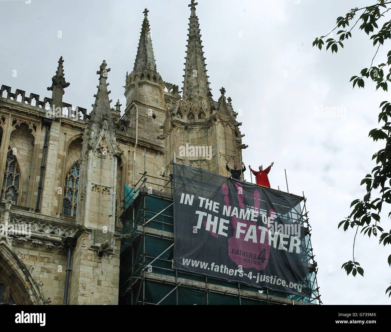 Fathers 4 Justice protest about the Church's failure to take the lead in lobbying the Government over fathers' who have no legal access to their children at York Minster where they disrupted the traditional Sunday service of the Church of England's General Synod. *13/09/04: A man dressed as Batman has climbed on to the Balcony of Buckingham Palace. Stock Photo