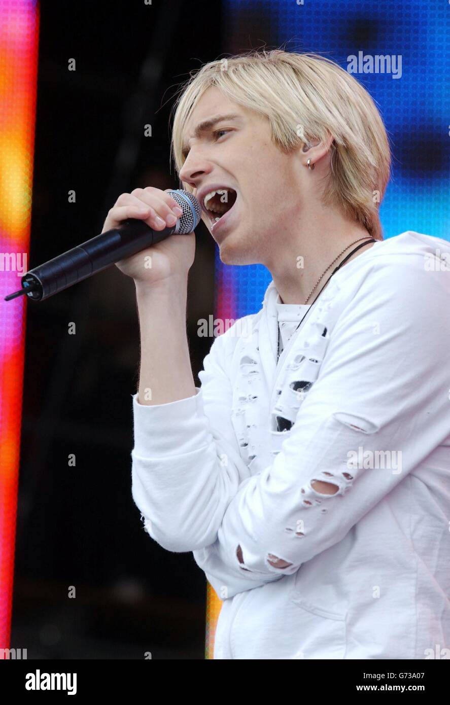 . . Lead singer of the rock group The Calling, Alex Band, performs onstage during the Capital Radio Party In The Park concert, held at Hyde Park, central London in aid of The Prince's Trust Stock Photo