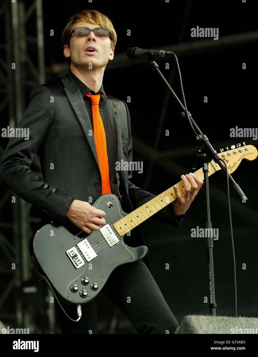 Alex Kapranos lead singer of Franz Ferdinand on the main stage during the second day of T in the Park, the two-day music festival event in Balado near Stirling. Stock Photo