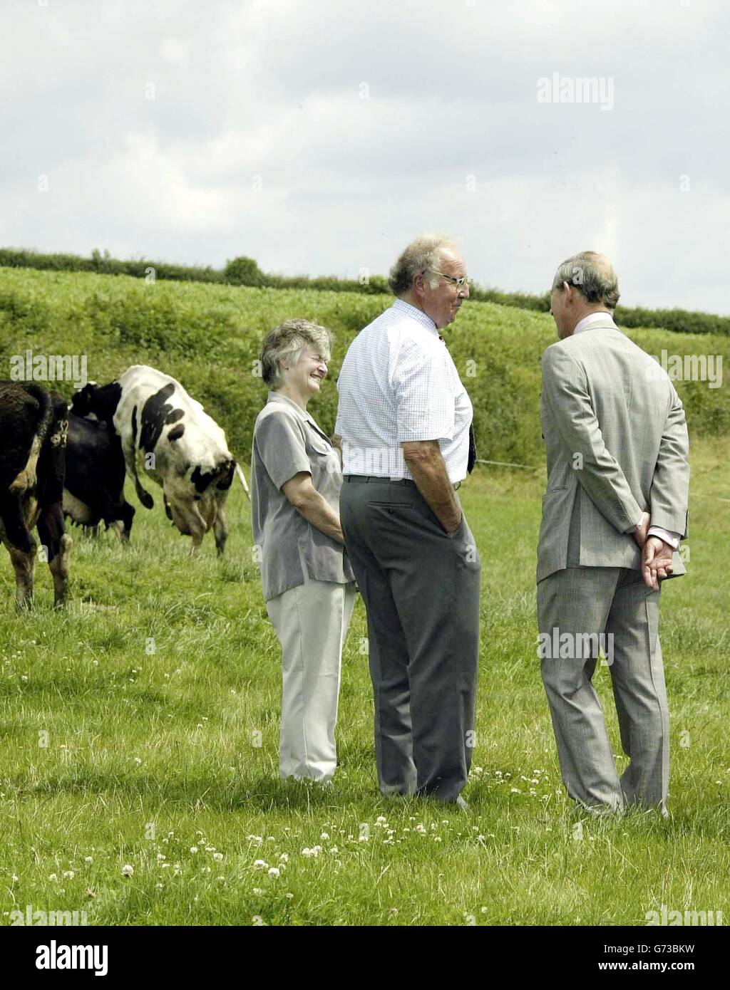 The Prince of Wales (right) meets local farmers at Trebersed Farm near Carmarthen, during his annual three-day summer visit to Wales. Whilst at the farm, the Prince was shown the South and West Wales Machinery Ring - an amalgamation of farmers who pool their resources to share expensive equipment, labour and resources. Stock Photo