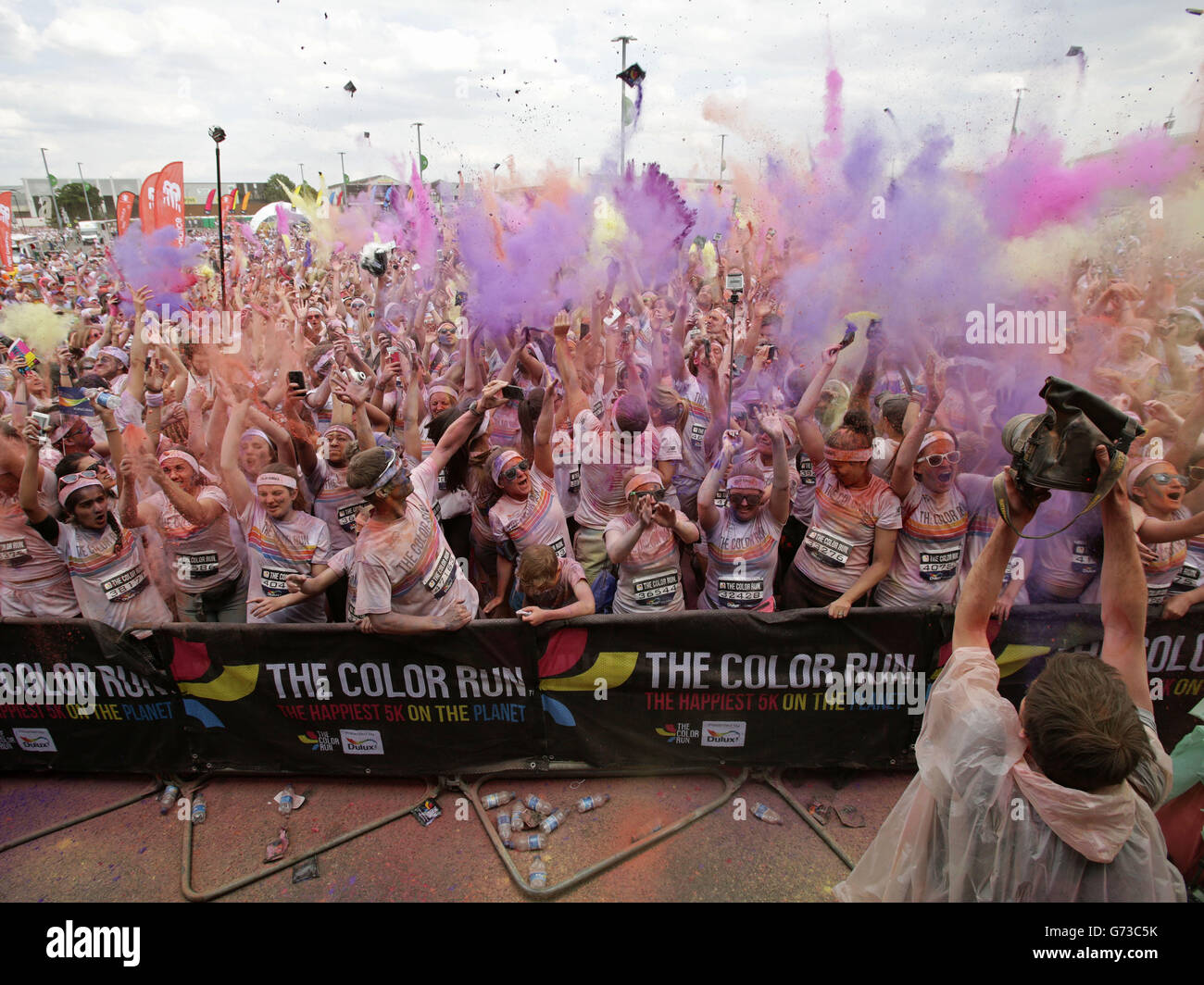 Runners take part in The Color Run in Wembley, London, a 5k run where at  each kilometre, colour explosions of powder made from cornstarch cover the  runners Stock Photo - Alamy
