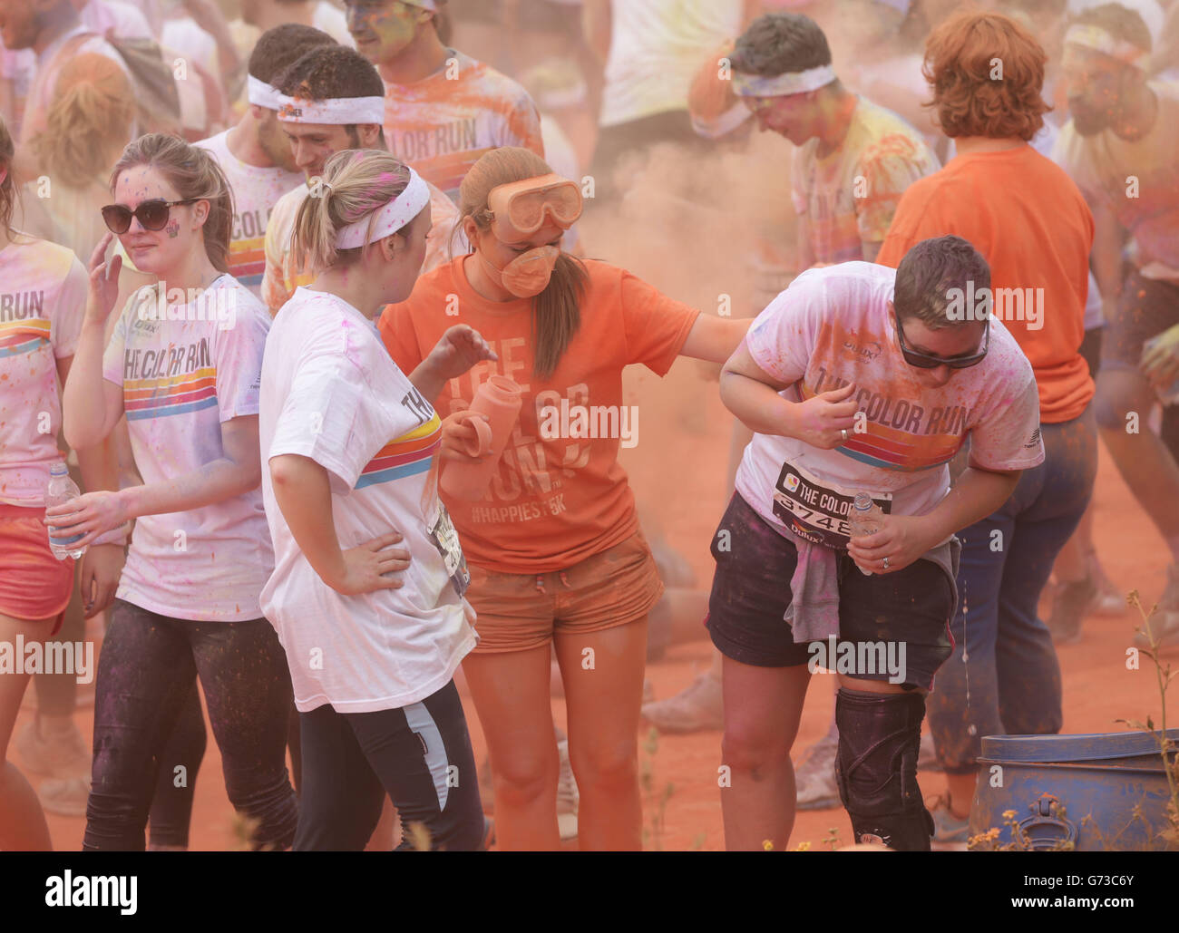 Runners cross the finish line at The Color Run in Wembley, London, a 5k ...