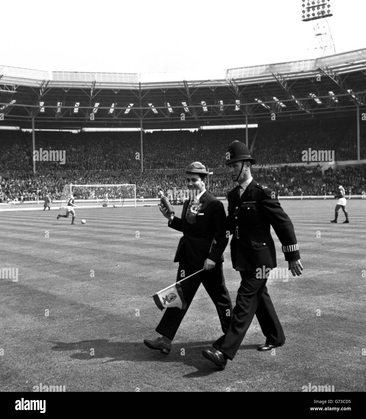 Escorted by a policeman hi-res stock photography and images - Alamy