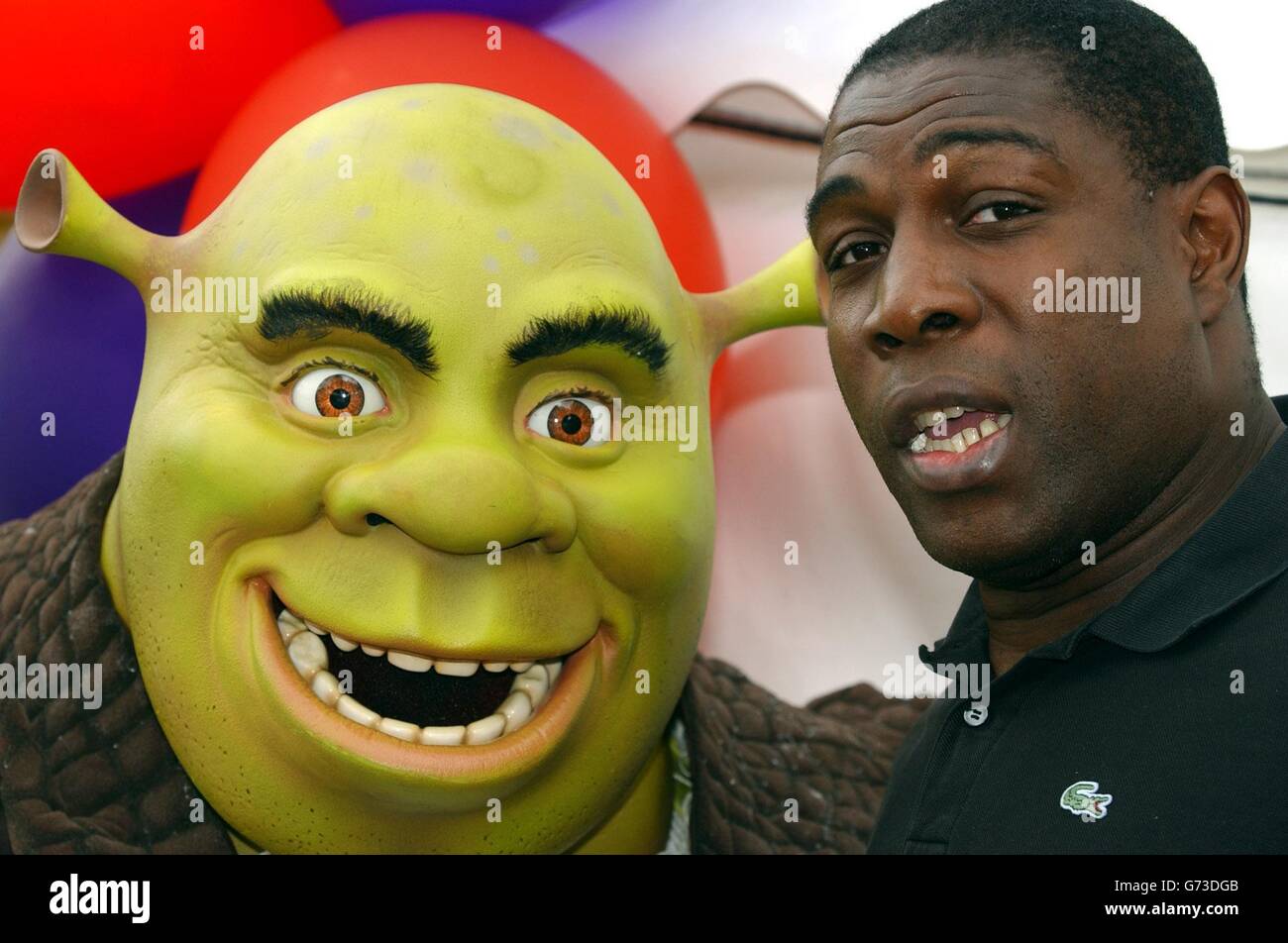 Frank Bruno and 'Shrek' during The Amazing Great Children's Party, in aid of Children with Lukaemia at Battersea Park in South London. The party - the largest annual event of its kind - aims to provide a memorable day for 6,000 deserving children from across the UK. Stock Photo