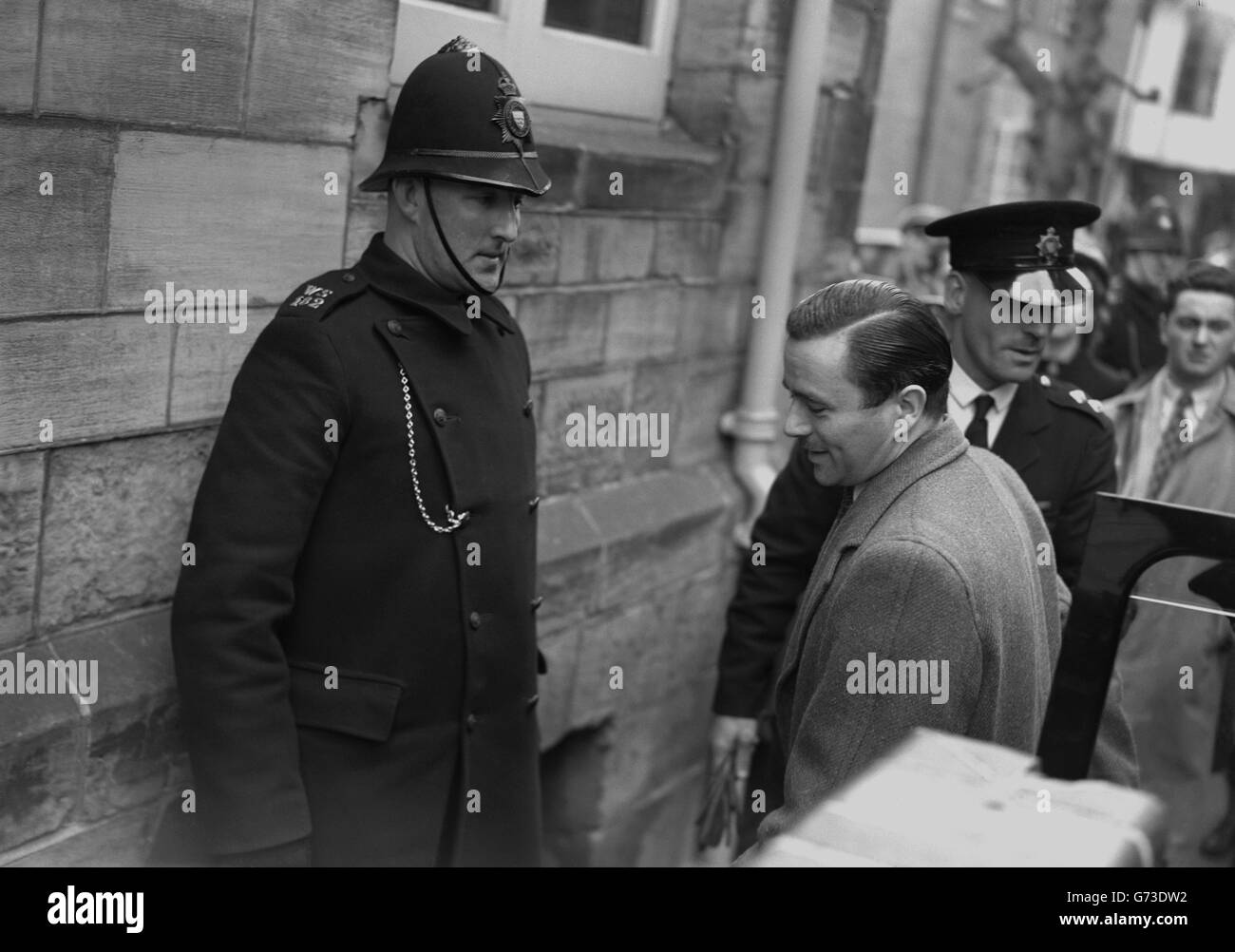 John George Haigh arriving under police escort at Horsham Magistrates' Court. The 39-year-old company director is being tried for the murder of Mrs Olive Durand-Deacon, one of the victims of the so-called 'Acid Bath Murders'. Stock Photo