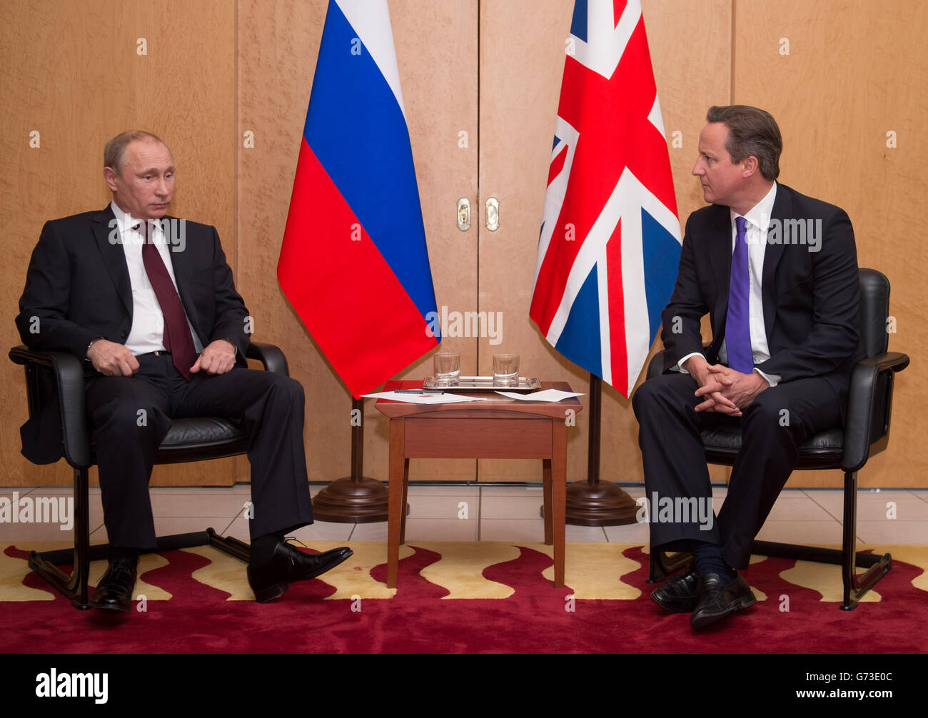 British Prime Minister David Cameron meets with Russian President Vladimir Putin (left) at Charles De Gaulle Airport in Paris, as they travelled to France ahead of the 70th anniversary D-Day commemorations. PRESS ASSOCIATION Photo. Picture date: Thursday June 5, 2014. See PA story POLITICS G7. Photo credit should read: Stefan Rousseau/PA Wire Stock Photo