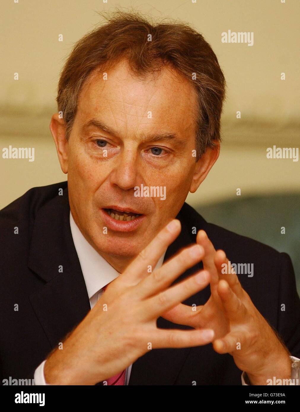 Britain's Prime Minister Tony Blair talks at a breakfast meeting about
