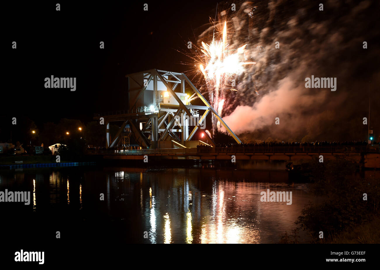Fireworks are launched to mark the moment that Pegasus Bridge was captured by British troops on 6th June 1944 which signalled the beginning of D-Day. Stock Photo
