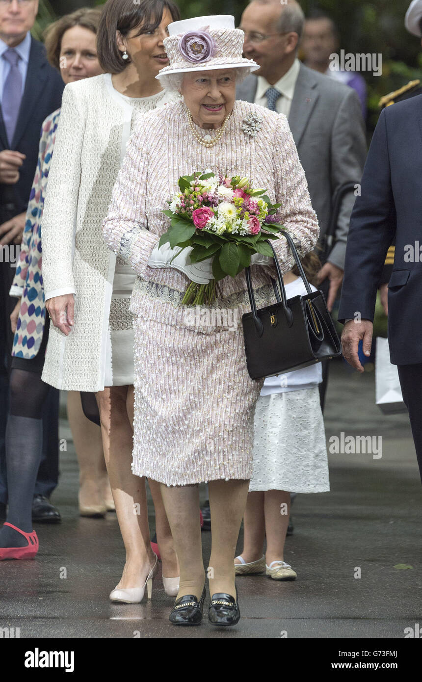 Queen Elizabeth II during a visit to the flower market at Marche aux Fleurs - Reine Elizabeth II, close to Notre Dame Cathedral in Paris as her three day State Visit to France comes to an end. PRESS ASSOCIATION Photo. Picture date: Saturday June 7, 2014. See PA story ROYAL Queen. Photo credit should read: Owen Humphreys/PA Wire Stock Photo