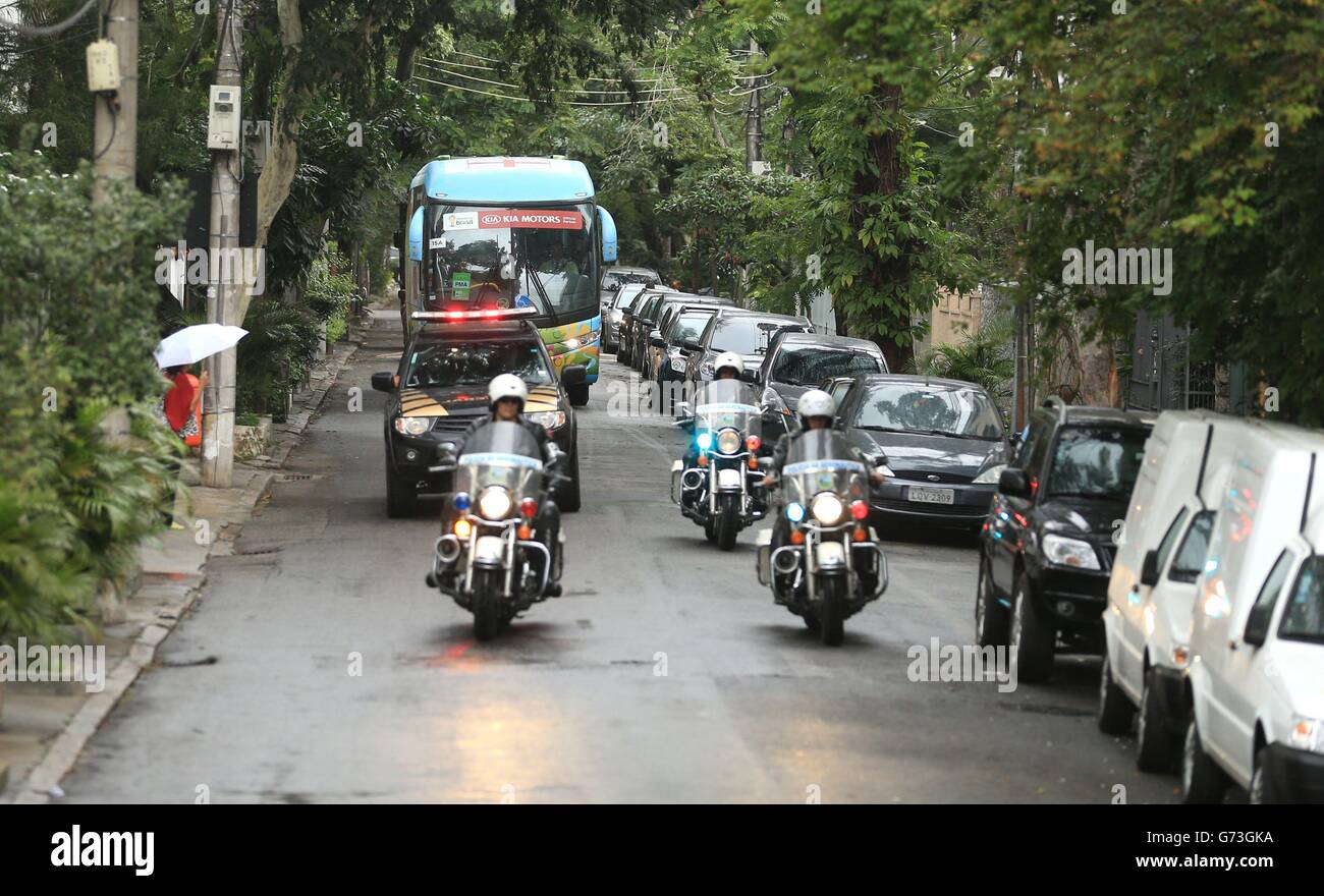 Soccer - FIFA World Cup 2014 - Group D - England v Italy - England Training Session and Press Conference - Day Two - Urca Mil.... Police escorts surround the England team bus as it arrives at Urca Military Training Ground, Rio de Janeiro, Brazil. Stock Photo