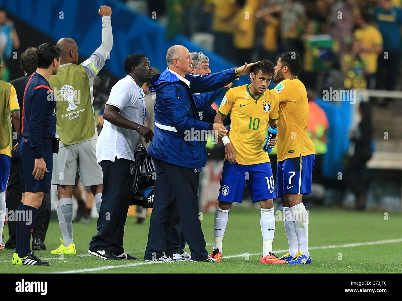 Soccer - FIFA World Cup 2014 - Group A - Brazil v Croatia - Arena Corinthians. Brazil's Neymar (10) celebrates on the touchline with manager Luiz Felipe Scolari after scoring his side's first goal Stock Photo