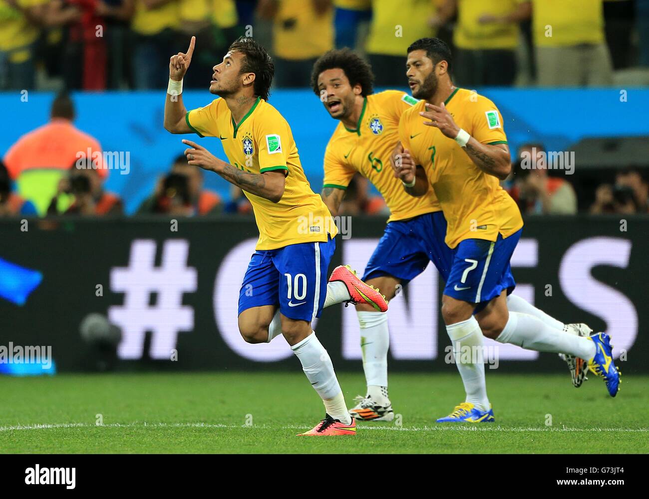 Brazil's Neymar (left) celebrates with Hulk and Marcelo after scoring his side's first goal Stock Photo