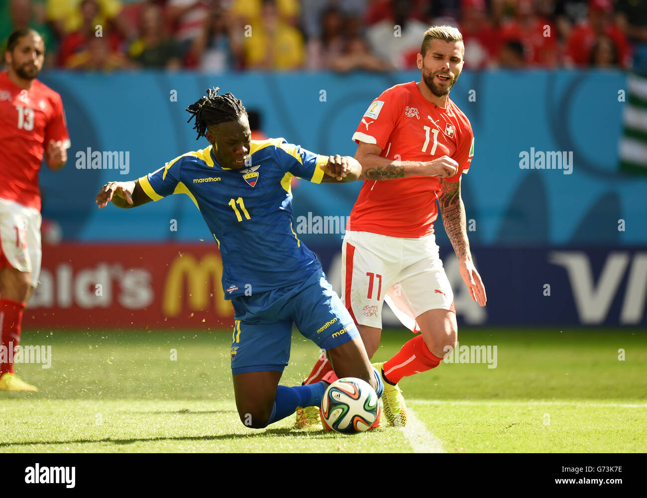 Soccer - FIFA World Cup 2014 - Group E - Switzerland v Ecuador - Estadio Nacional. Ecuador's Felipe Caicedo (left) and Switzerland's Valon Behrami battle for the ball Stock Photo
