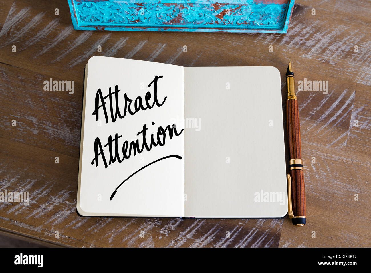 Text Attract Attention handwritten on notebook Stock Photo Alamy