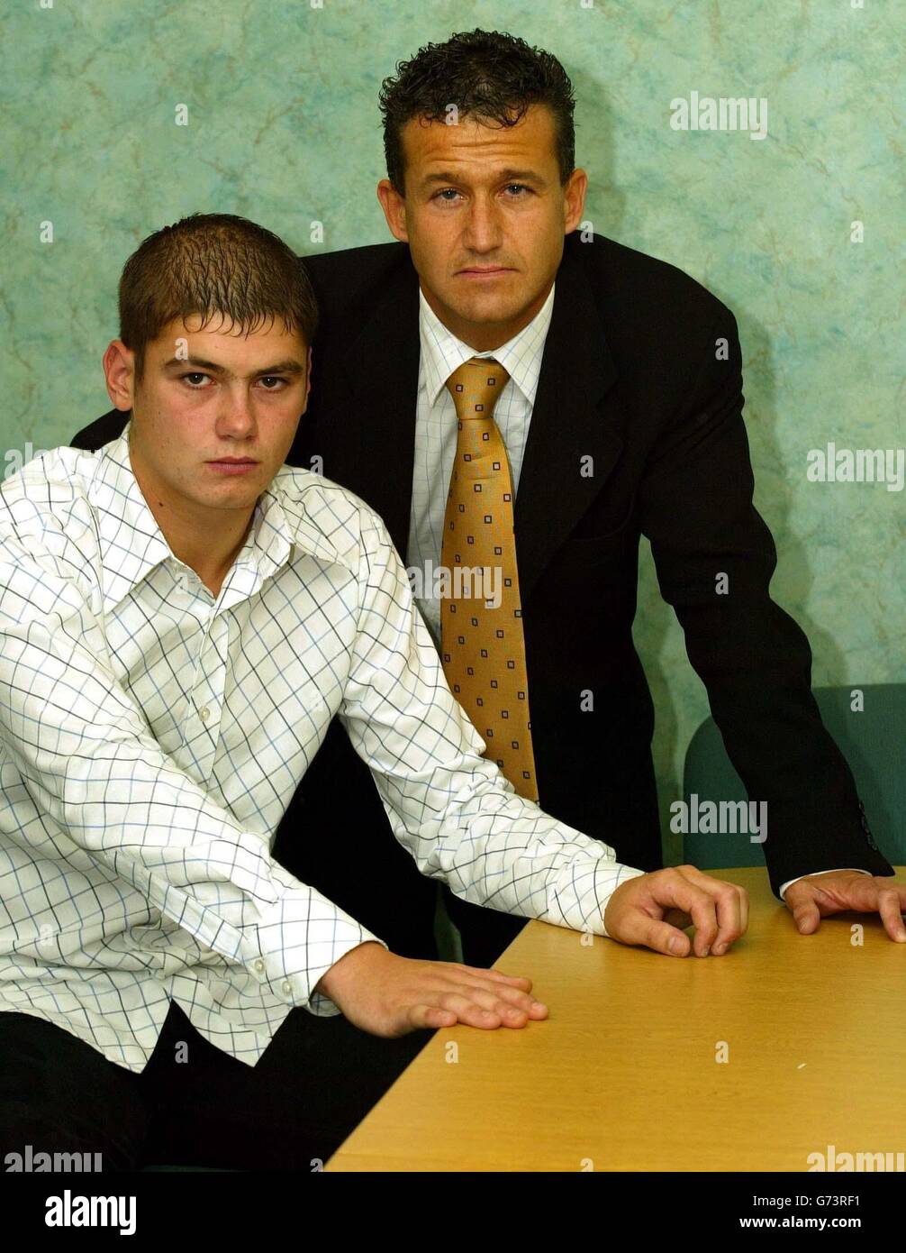 Craig McMillan (left) with his lawyer Massimo Franchi during a press conference in Glasgow, Scotland, where Mr McMillan admitted that he was thoroughly 'ashamed of his conduct' chopping off a young woman's hair during a Club 18-30 holiday in Faliraki, Rhodes. A statement read today by Mr McMillan's lawyer said: 'He wishes to take this opportunity to state that the conduct in which he became involved was shameful and inexcusable and he now appreciates that in the sober light of day that the upset and anguish caused to Georgina Ludden was considerable.' Stock Photo