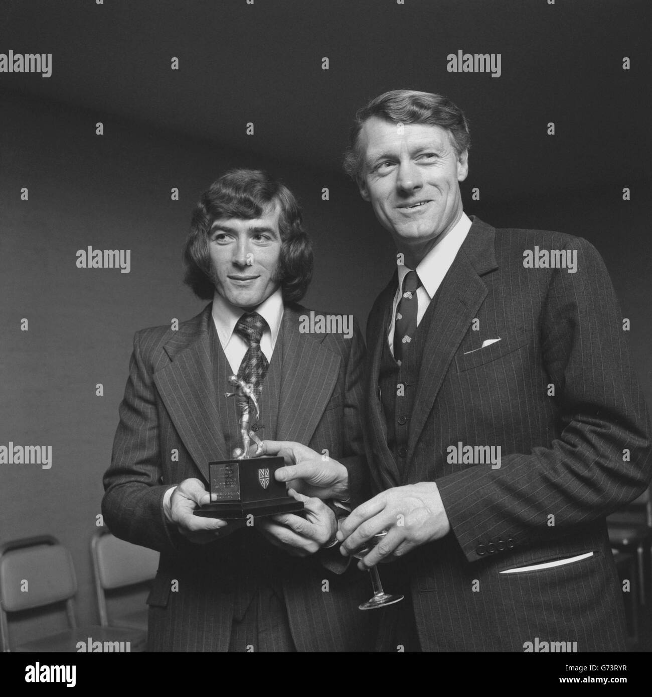 Pat Jennings (l), Tottenham Hotspur and Northern Ireland goalkeeper, with the 1973 Footballer of the Year trophy awarded to him in an annual poll conducted by the Football Writers' Association and presented to him in London. Alongside him is Eldon Griffiths, Minister for Sport. Stock Photo