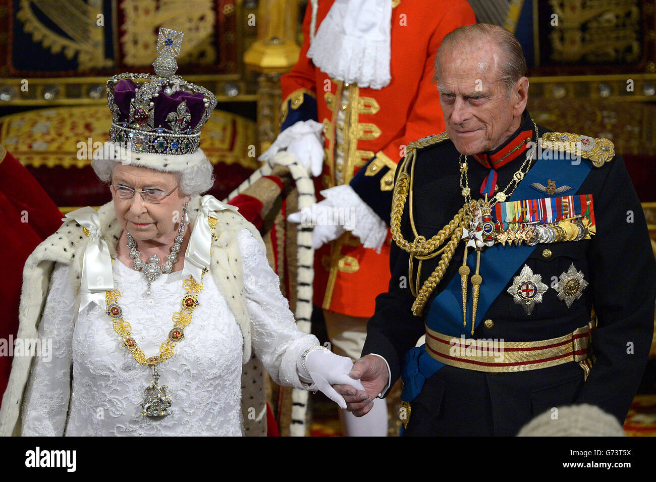 The Duke of Edinburgh and Queen Elizabeth II leave the House of Lords after delivering her speech in the House of Lords during the State Opening of Parliament at the Palace of Westminster in London. Stock Photo