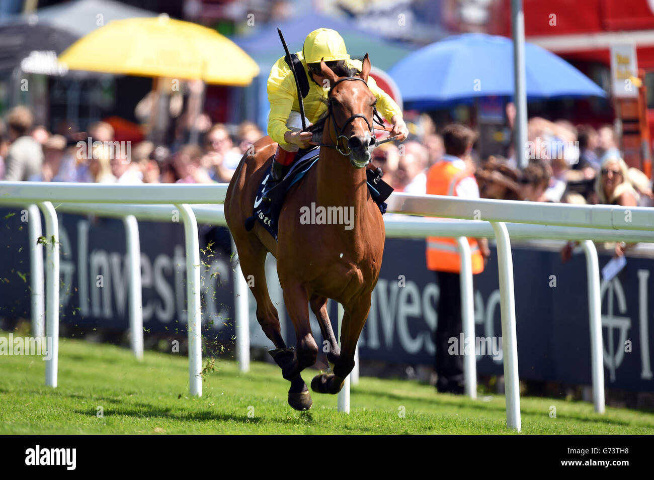 Farraaj ridden by Andrea Atzeni on their way to winning the Investec Wealth &amp; Investment Handicap during Investec Ladies Day at Epsom Downs Racecourse, Surrey. Stock Photo
