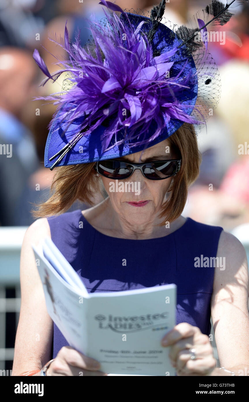 Racegoers during Investec Ladies Day at Epsom Downs Racecourse, Surrey. Stock Photo