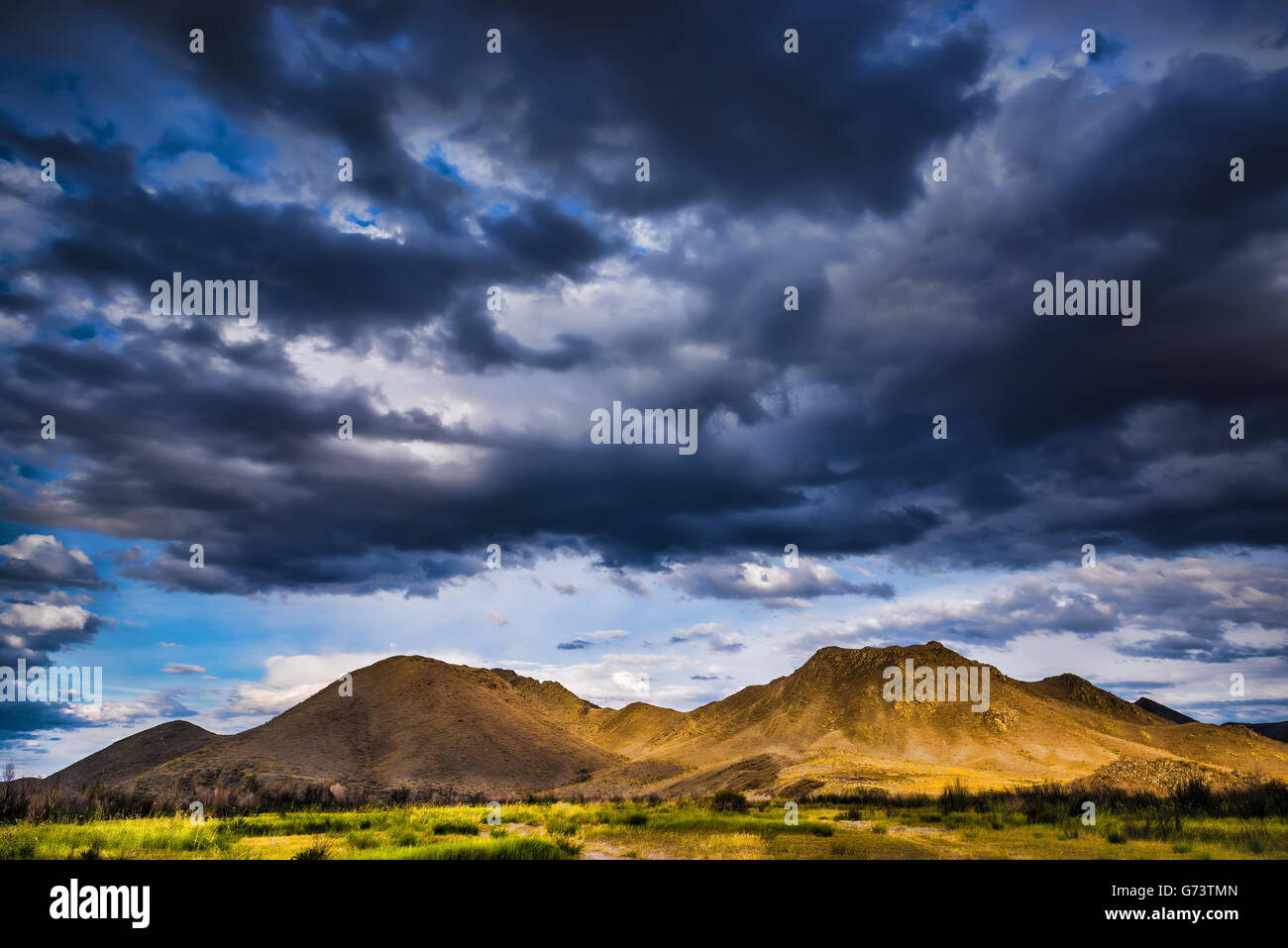 Stormy clouds over mountains Stock Photo - Alamy