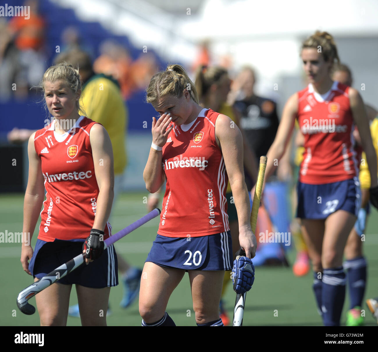 England's Hollie Webb (centre) walks off dejected after their Pool B game in the Rabobank Hockey World Cup at the GrenFields Stadium, Den Haag. Stock Photo