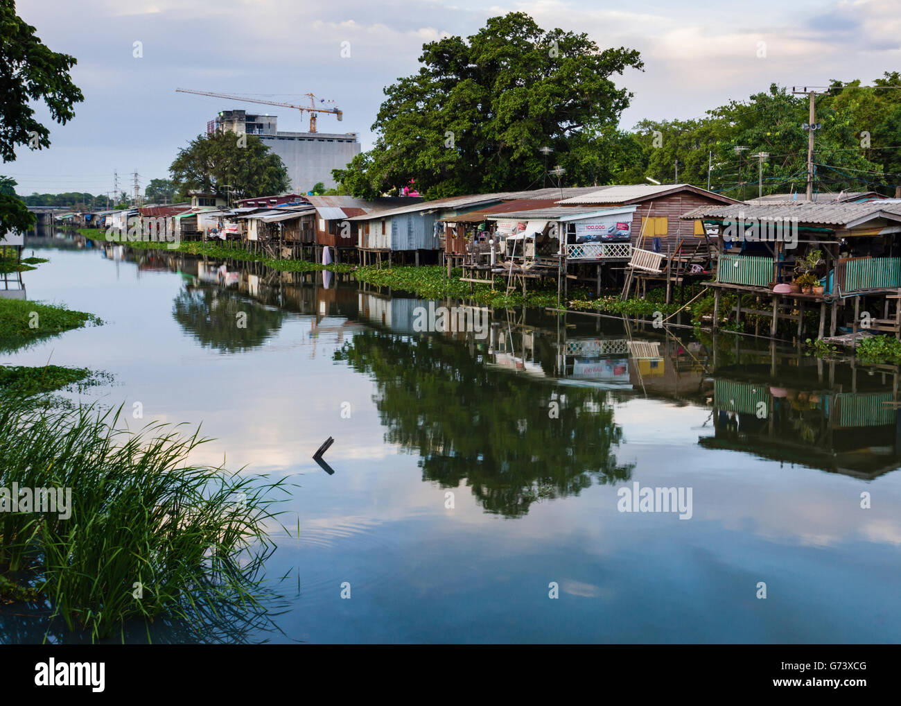A shanty tow along a canal in the Thai Provence of Pathum Thani. Stock Photo