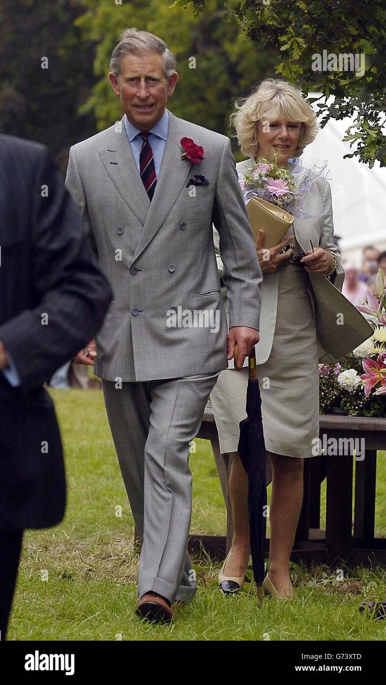 Prince Charles, The Prince of Wales, and Mrs Camilla Parker Bowles walk around the Sandringham Flower Show, Norfolk. The couple, who are on holiday in the area, spent two hours touring the show held on the grounds of the Queen's estate. This is the third year they have attended the event together. Stock Photo