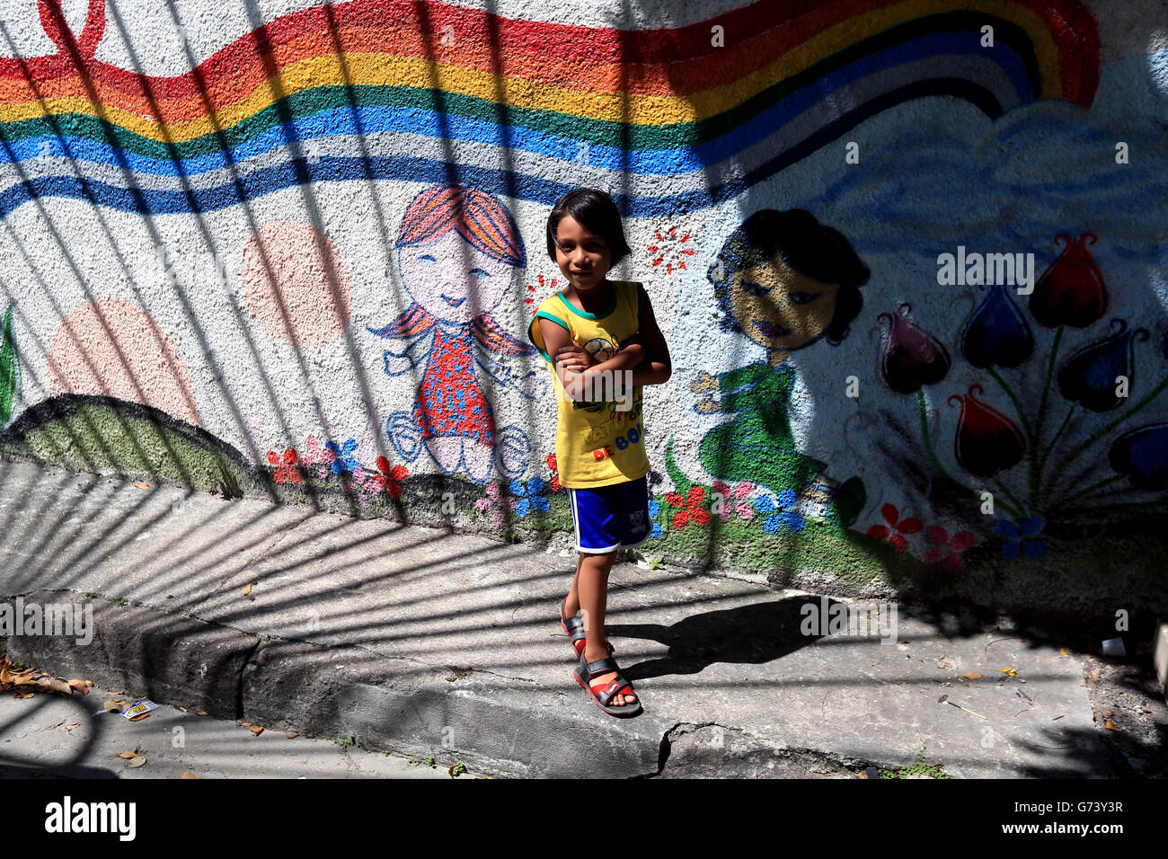Soccer - FIFA World Cup 2014 - Group D - England v Italy - Arena da Amazonia. A local boy plays football in the street ahead of this evenings match at the Arena da Amazonia, Manaus, Brazil. Stock Photo