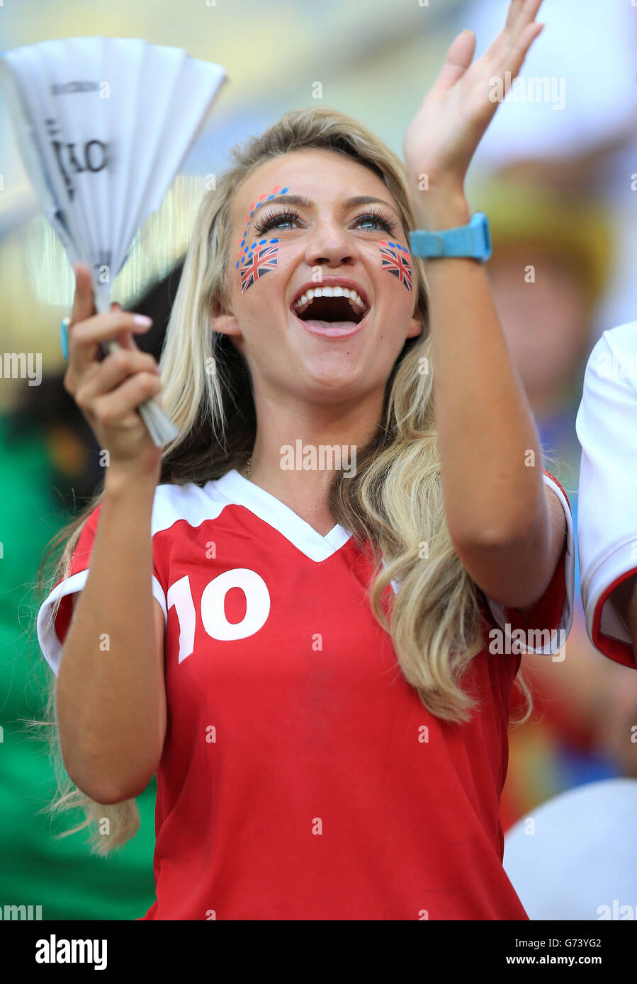 An England fan shows support for her team before kick-off in the FIFA World Cup, Group D match at the Arena da Amazonia, Manaus, Brazil. Stock Photo