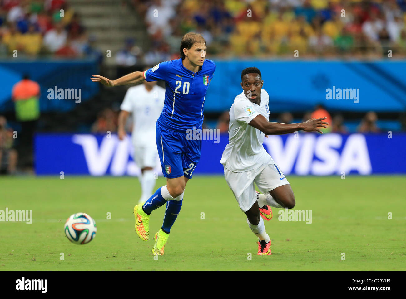 England's Danny Welbeck (right) and Italy's Gabriel Paletta battle for the ball during the FIFA World Cup, Group D match at the Arena da Amazonia, Manaus, Brazil. Stock Photo