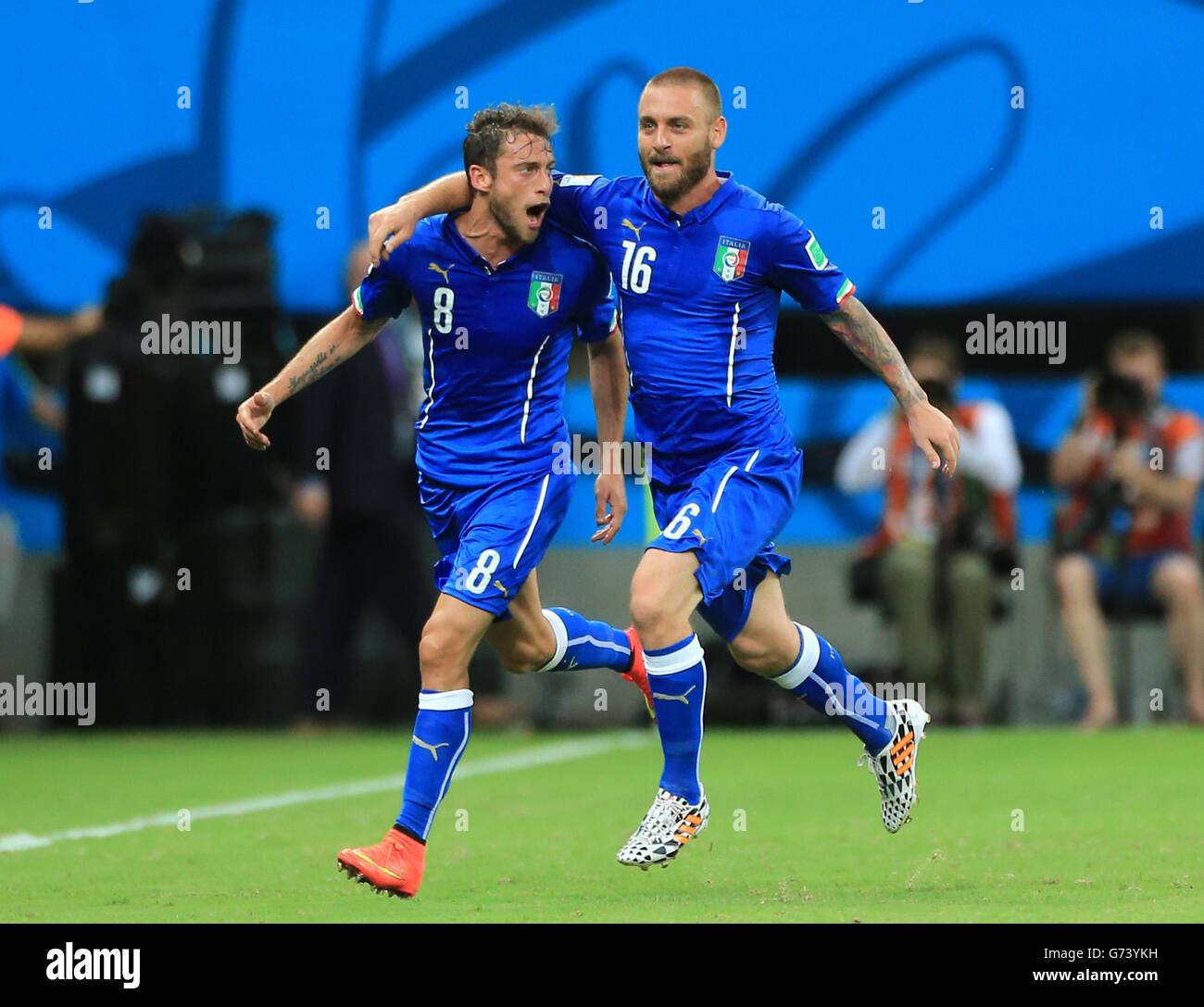 Italy's Claudio Marchisio (left) celebrates scoring his side's first goal of the game with teammate Daniele de Rossi during the FIFA World Cup, Group D match at the Arena da Amazonia, Manaus, Brazil. Stock Photo